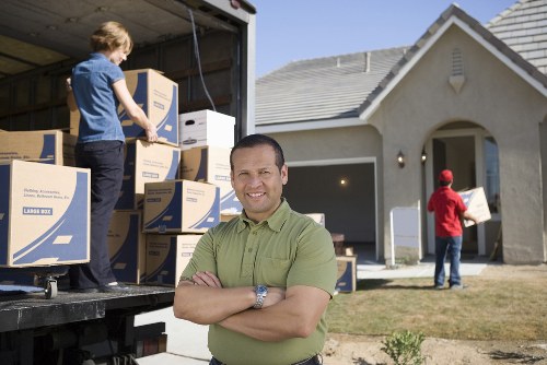 Professional movers loading furniture for a Downe relocation